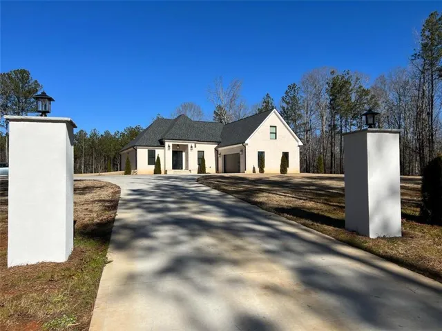 a view of large house with a yard