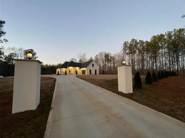 an aerial view of a house with outdoor space
