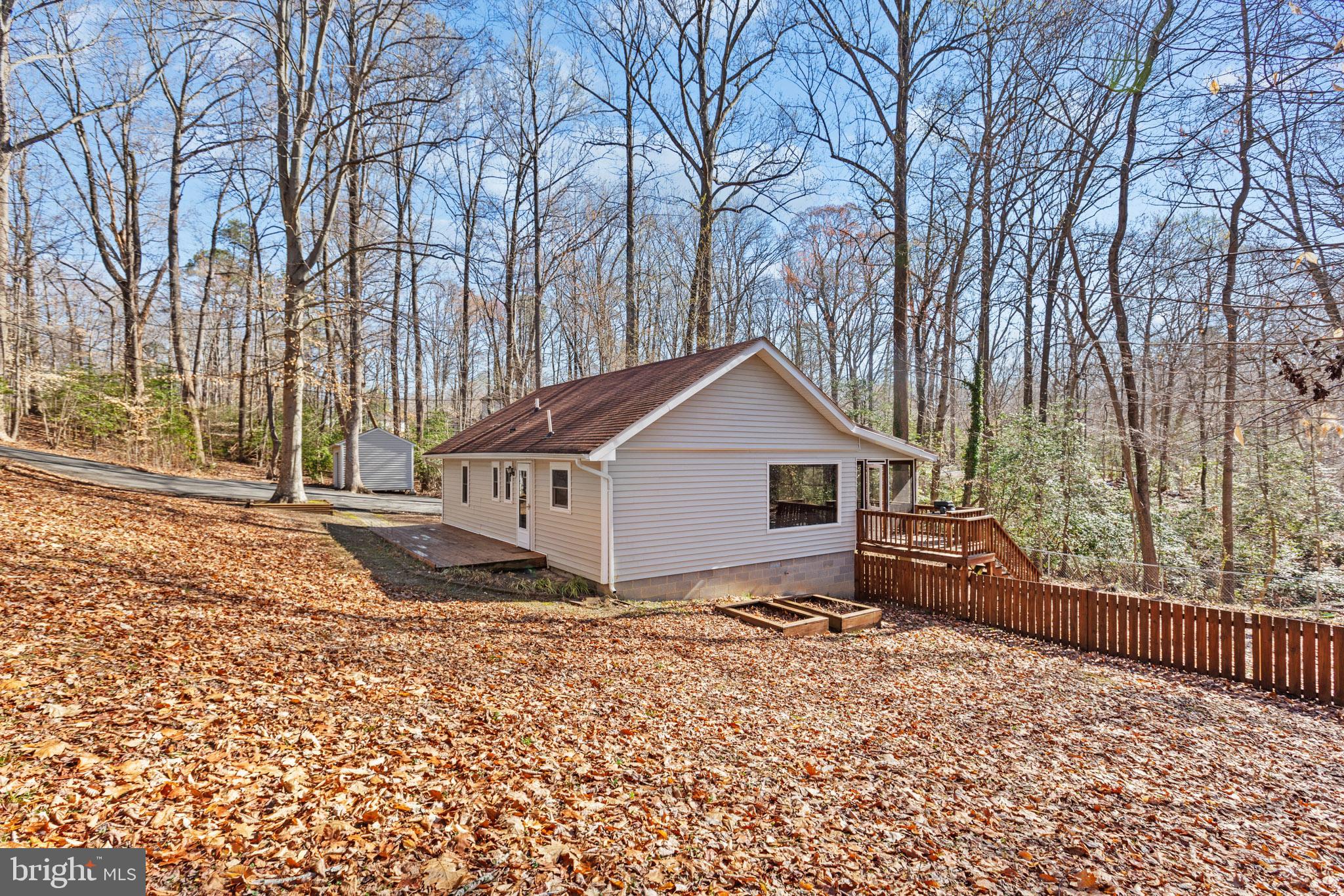 12646 High Sierra Road Lusby, MD 20657 - Photo 19 of 36 front view of a house with a yard