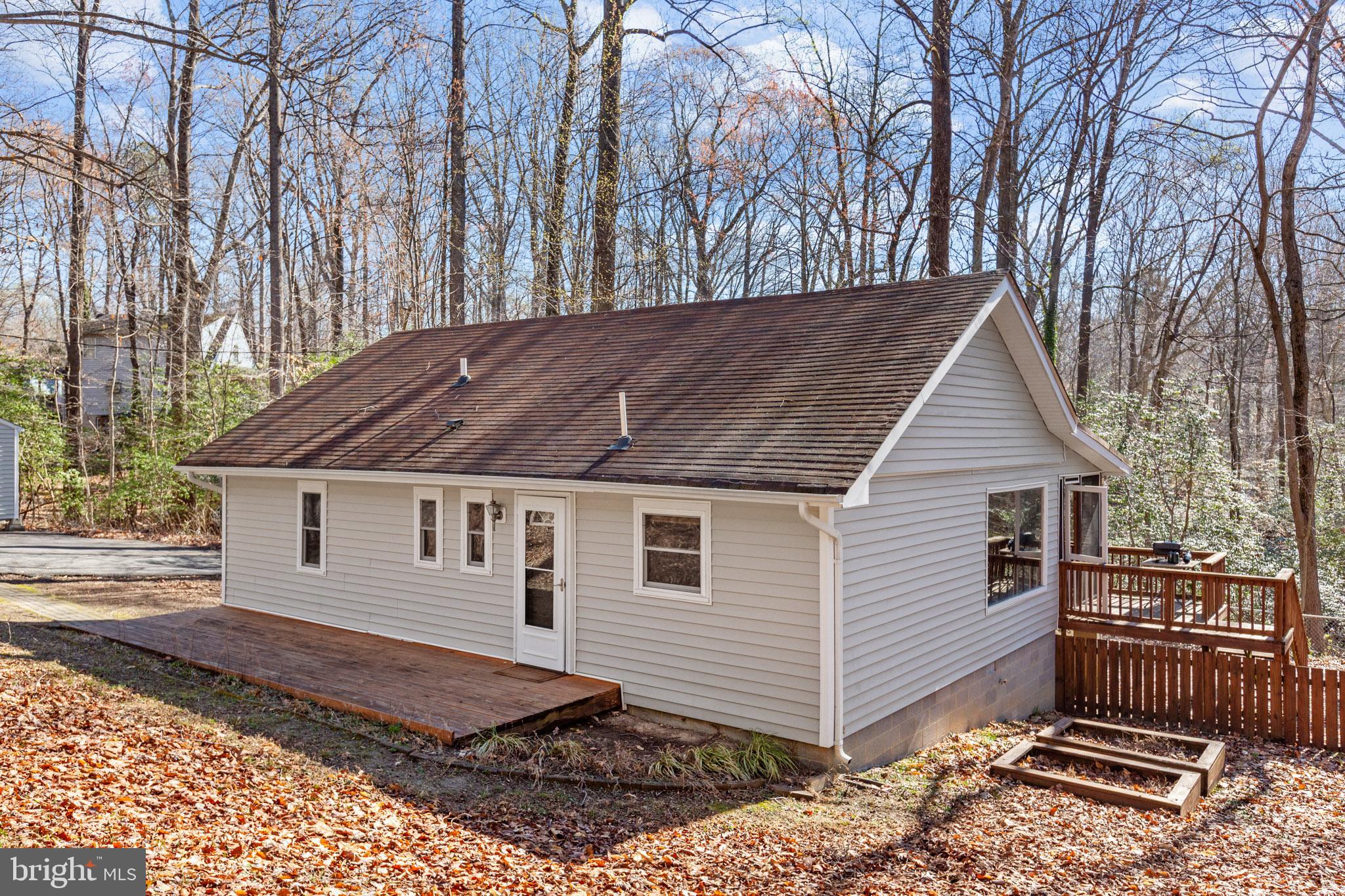 12646 High Sierra Road Lusby, MD 20657 - Photo 21 of 36 a view of a house with a yard