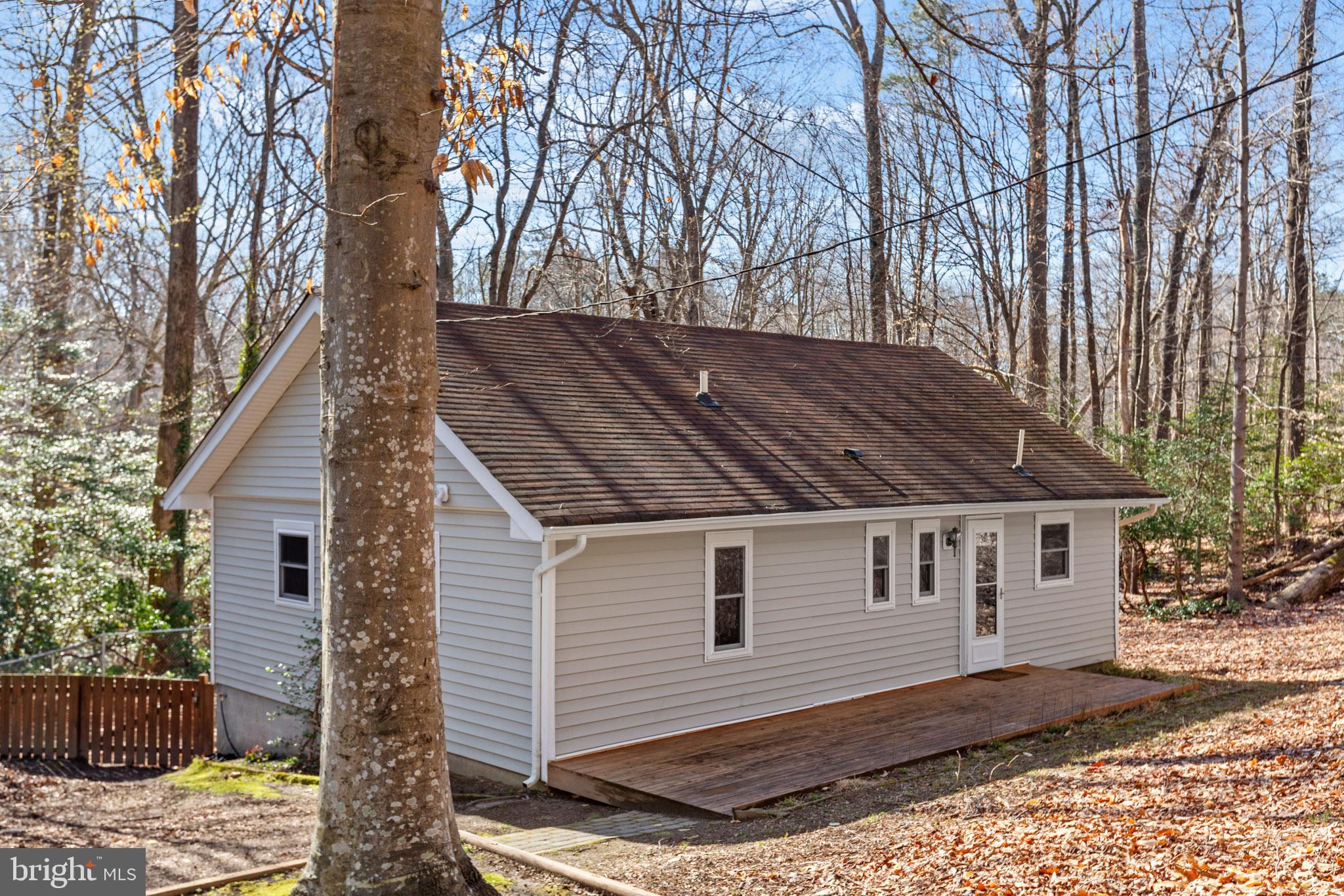 12646 High Sierra Road Lusby, MD 20657 - Photo 23 of 36 a view of a house with a yard