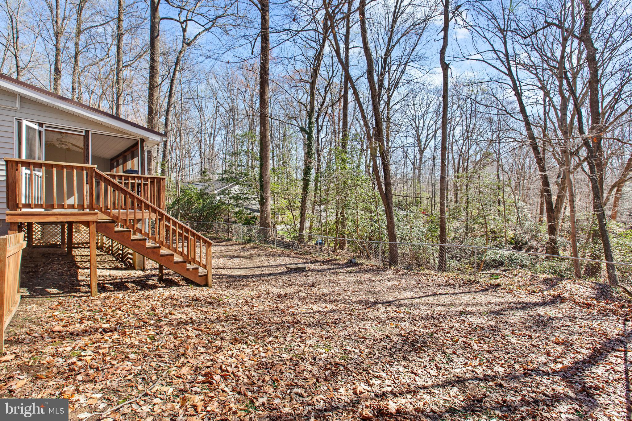 12646 High Sierra Road Lusby, MD 20657 - Photo 27 of 36 a view of outdoor space with deck and trees