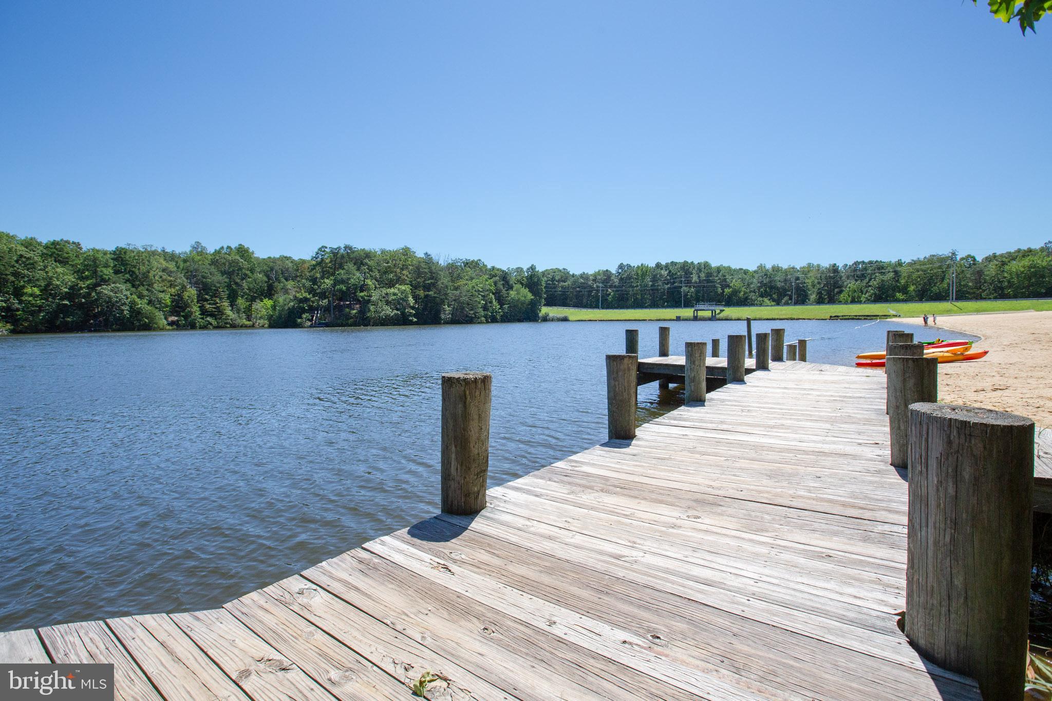 12646 High Sierra Road Lusby, MD 20657 - Photo 30 of 36 a view of a lake with sitting area