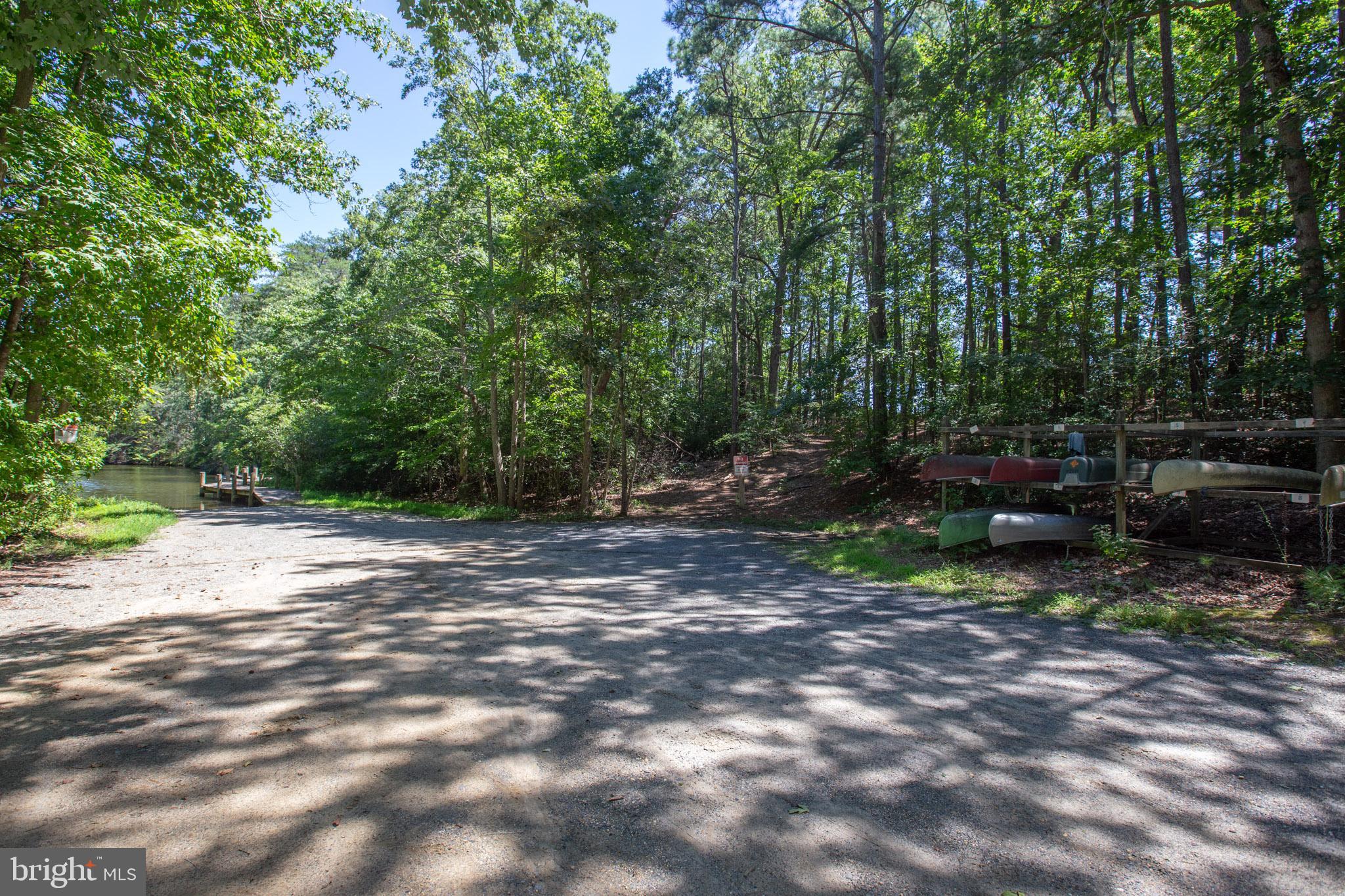 12646 High Sierra Road Lusby, MD 20657 - Photo 33 of 36 a view of a park with large trees