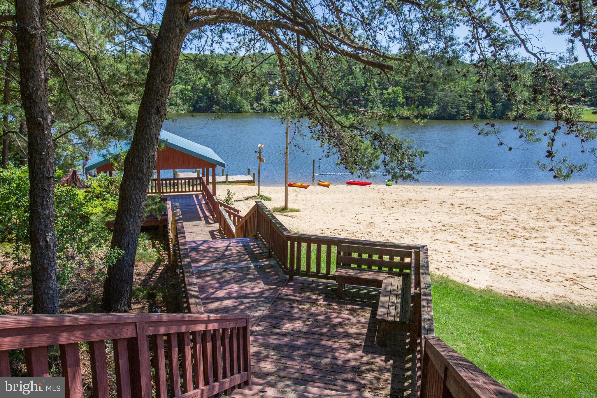 12646 High Sierra Road Lusby, MD 20657 - Photo 34 of 36 a view of a roof deck with wooden fence and a couple of chairs