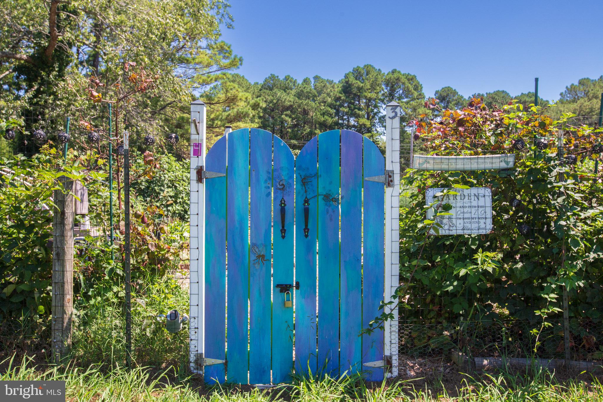 12646 High Sierra Road Lusby, MD 20657 - Photo 35 of 36 a view of a wooden fence and a bench