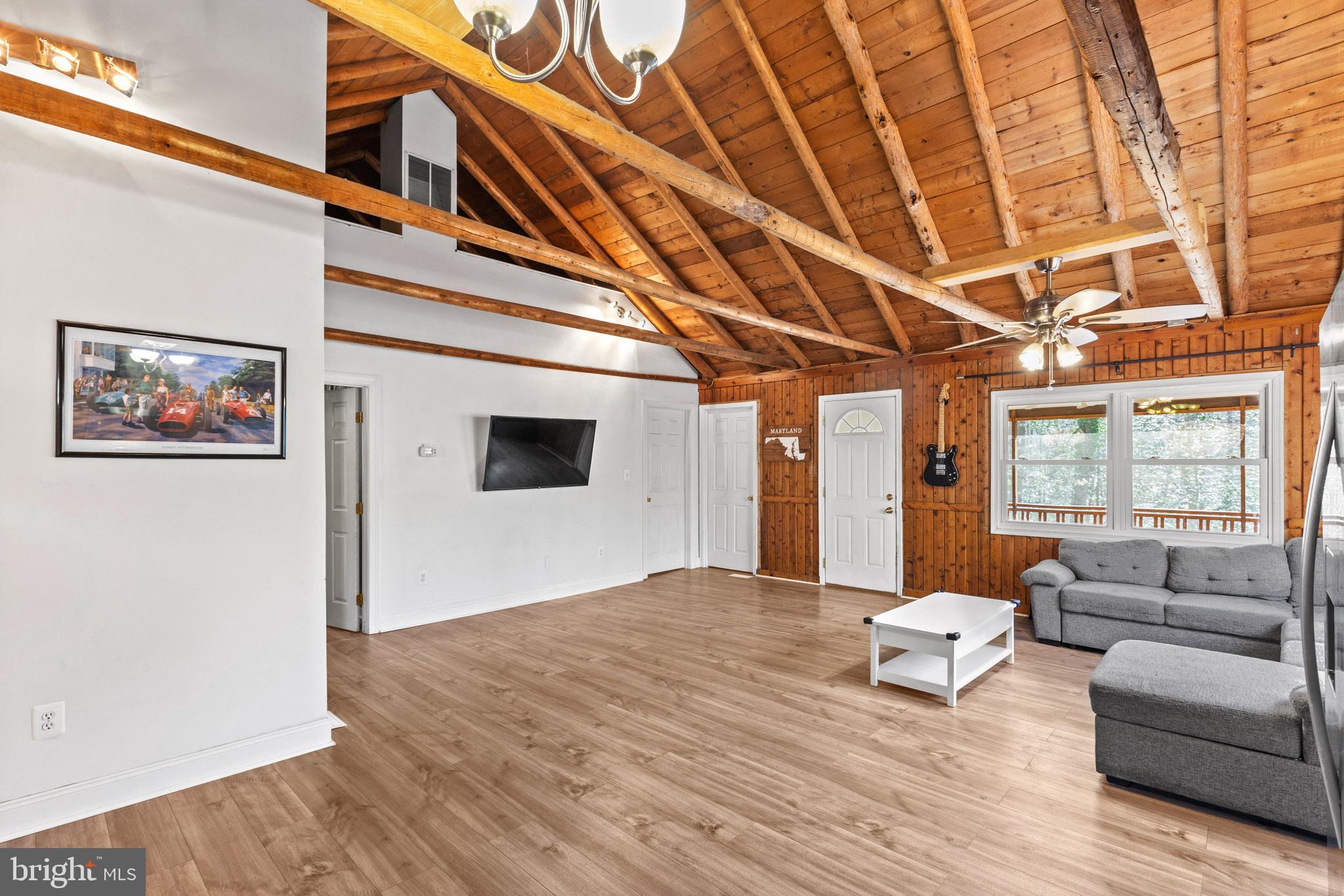 12646 High Sierra Road Lusby, MD 20657 - Photo 6 of 36 a living room with furniture and a flat screen tv