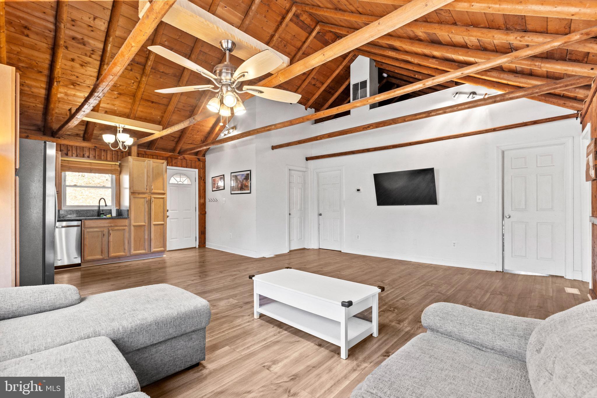 12646 High Sierra Road Lusby, MD 20657 - Photo 8 of 36 a living room with furniture and a flat screen tv