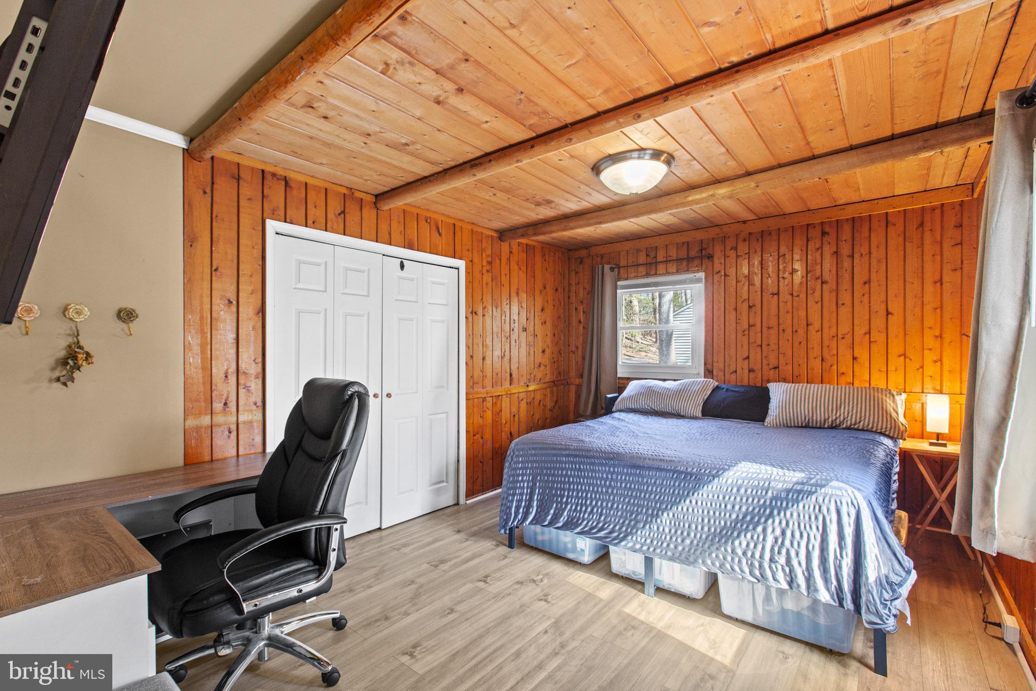 12646 High Sierra Road Lusby, MD 20657 - Photo 9 of 36 a bedroom with a bed and a window