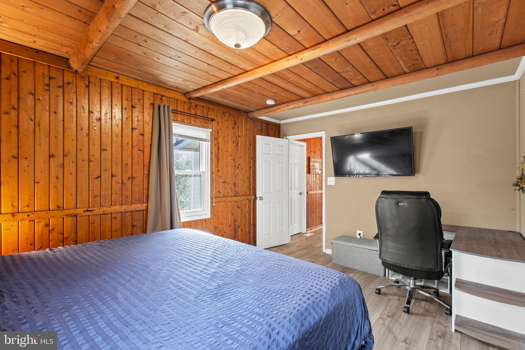 12646 High Sierra Road Lusby, MD 20657 - Photo 10 of 36 a bedroom with a bed and a chair