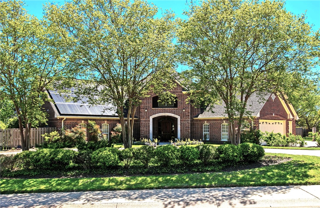6015 Augusta Circle College Station, TX 77845 - Photo 1 of 1 a front view of a house with garden