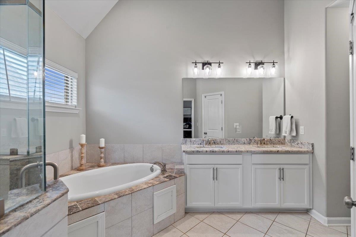 270 Whispering Ridge Drive Oakland, TN 38060 - Photo 12 of 27 a bathroom with a sink and a mirror