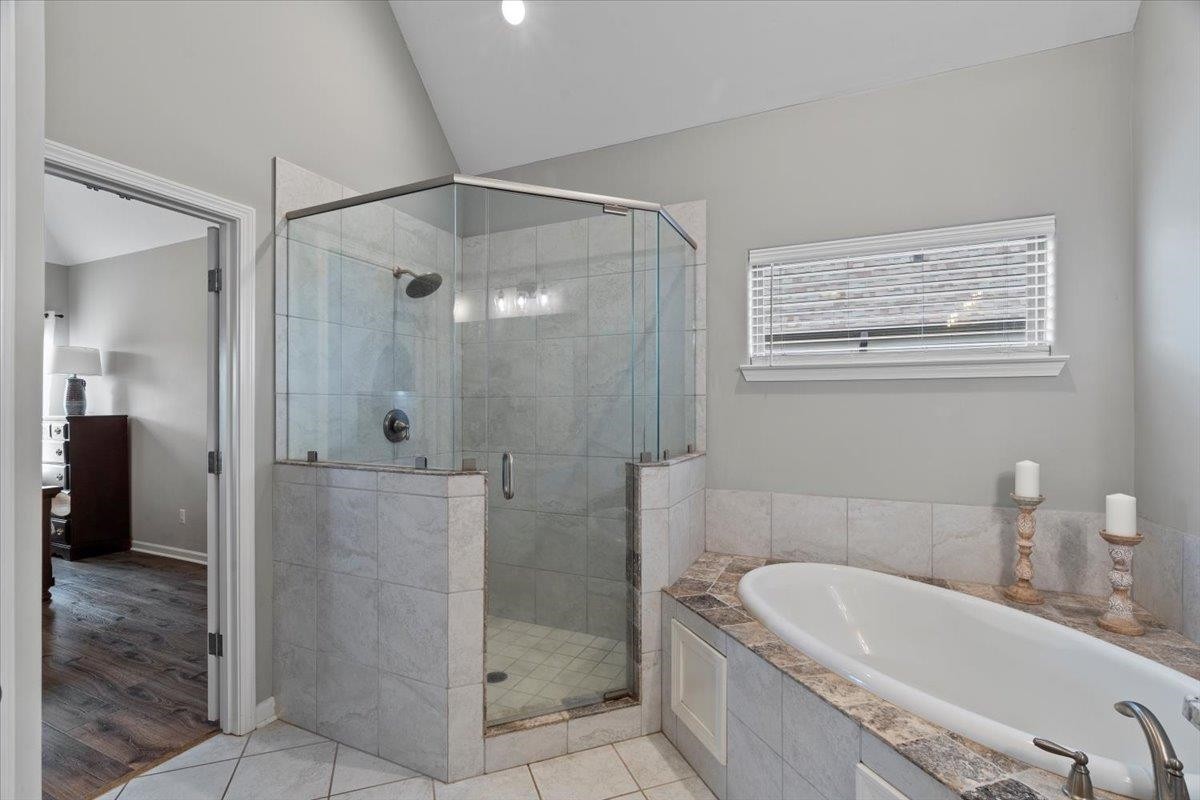 270 Whispering Ridge Drive Oakland, TN 38060 - Photo 13 of 27 a bathroom with a granite countertop bathtub shower and sink