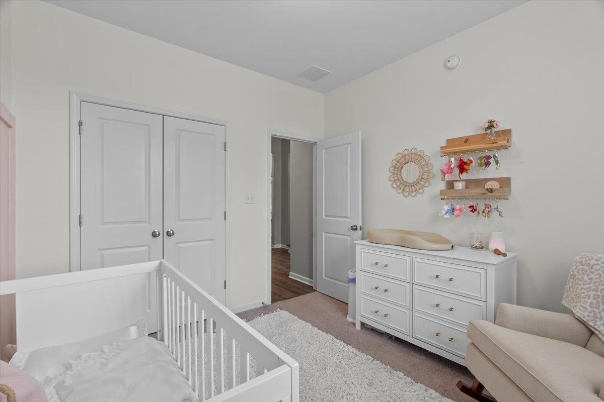270 Whispering Ridge Drive Oakland, TN 38060 - Photo 16 of 27 a room with a baby crib and a dresser