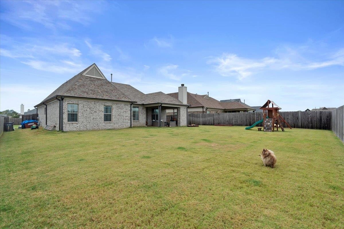 270 Whispering Ridge Drive Oakland, TN 38060 - Photo 23 of 27 a front view of a house with a yard