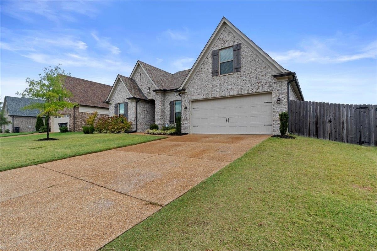 270 Whispering Ridge Drive Oakland, TN 38060 - Photo 26 of 27 a front view of a house with a yard