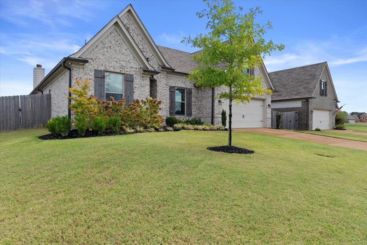 270 Whispering Ridge Drive Oakland, TN 38060 - Photo 27 of 27 a front view of a house with yard