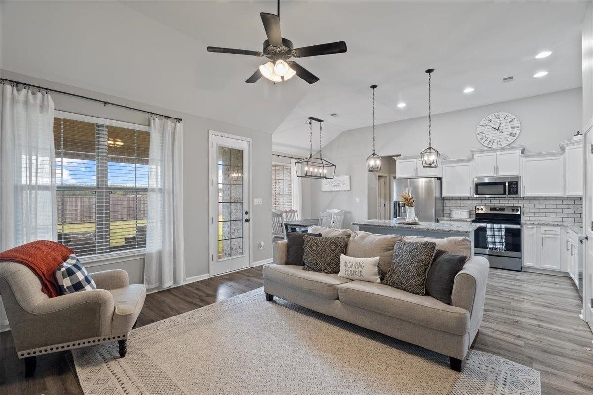 270 Whispering Ridge Drive Oakland, TN 38060 - Photo 6 of 27 a large living room with furniture and a large window