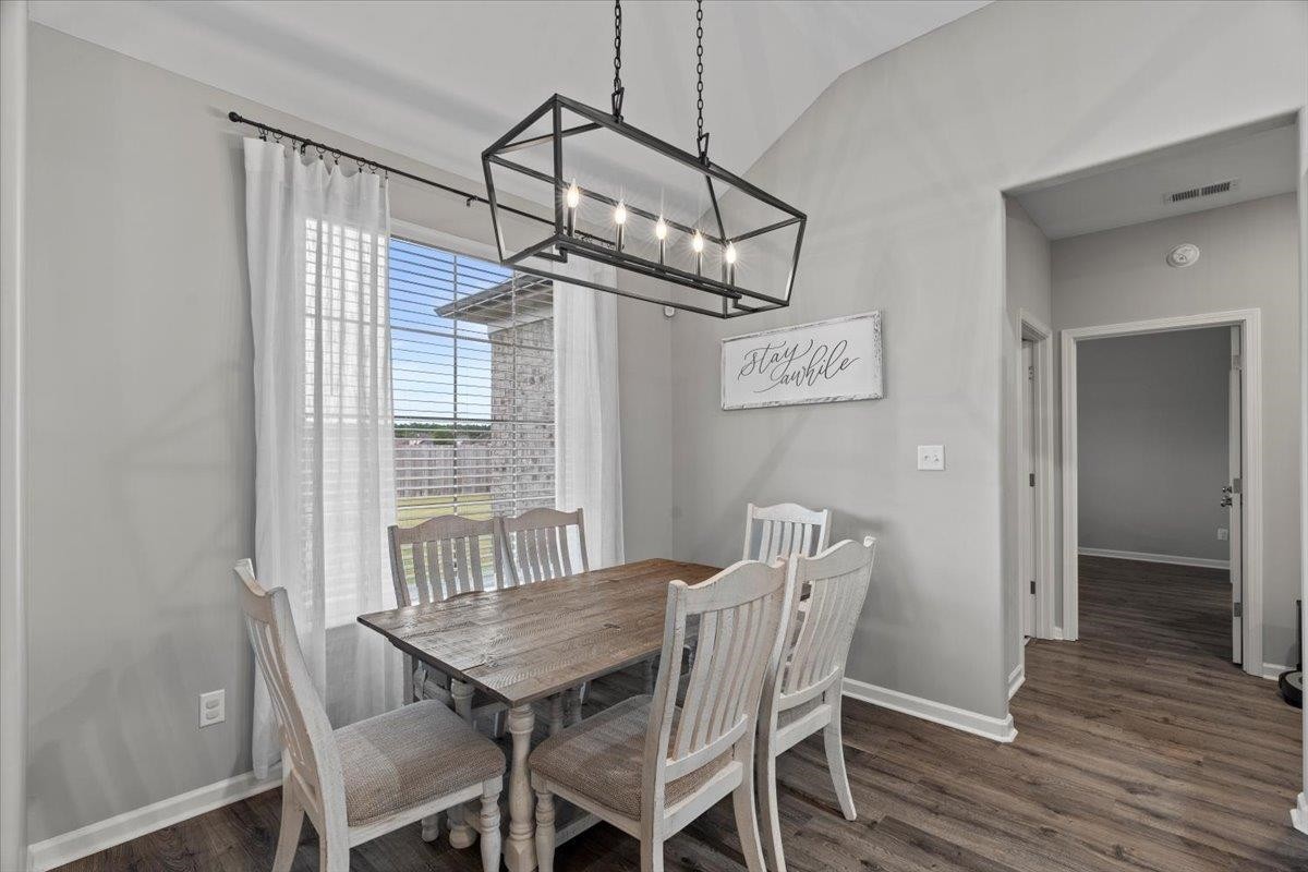 270 Whispering Ridge Drive Oakland, TN 38060 - Photo 8 of 27 a view of a dining room with furniture window and wooden floor