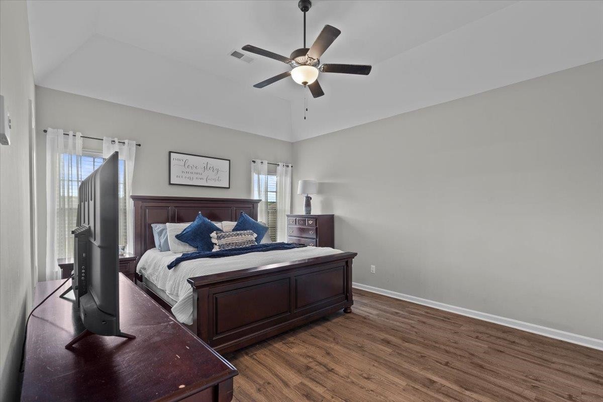 270 Whispering Ridge Drive Oakland, TN 38060 - Photo 9 of 27 a bedroom with a bed and a ceiling fan