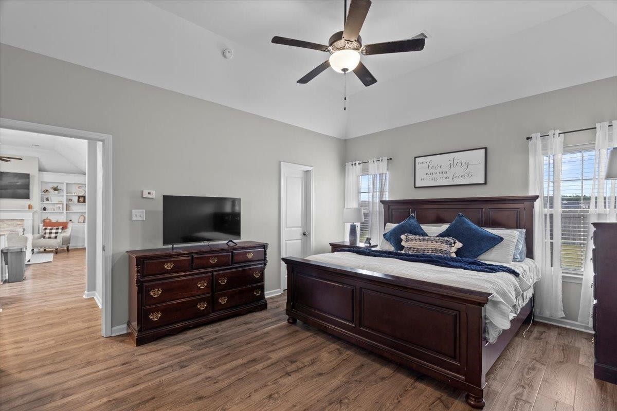 270 Whispering Ridge Drive Oakland, TN 38060 - Photo 10 of 27 a bedroom with a bed and a flat screen tv