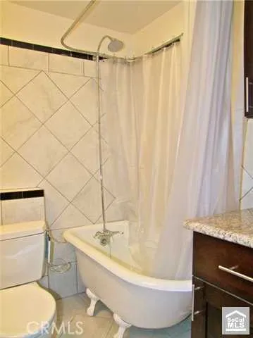 a bathroom with a toilet and a sink