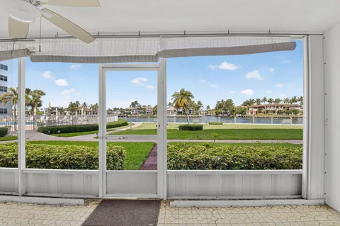 a view of a porch with a floor to ceiling window