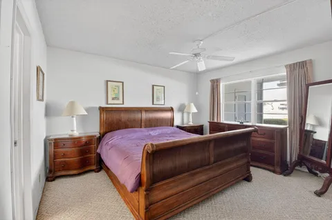 a bed room with a bed and a chandelier