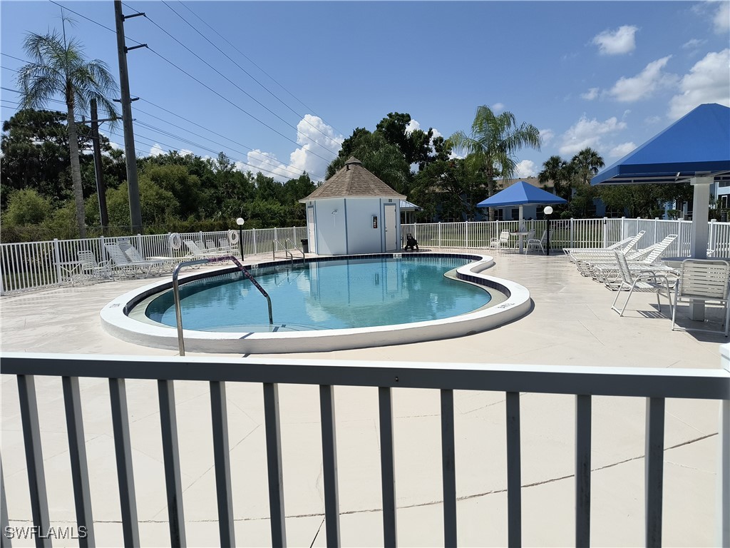 1100 Pondella Road, Unit 1001 Cape Coral, FL 33909 - Photo 14 of 14 a view of a swimming pool with a patio