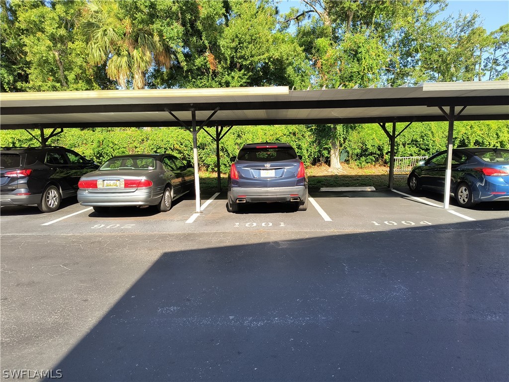 1100 Pondella Road, Unit 1001 Cape Coral, FL 33909 - Photo 2 of 14 a view of car parked in city