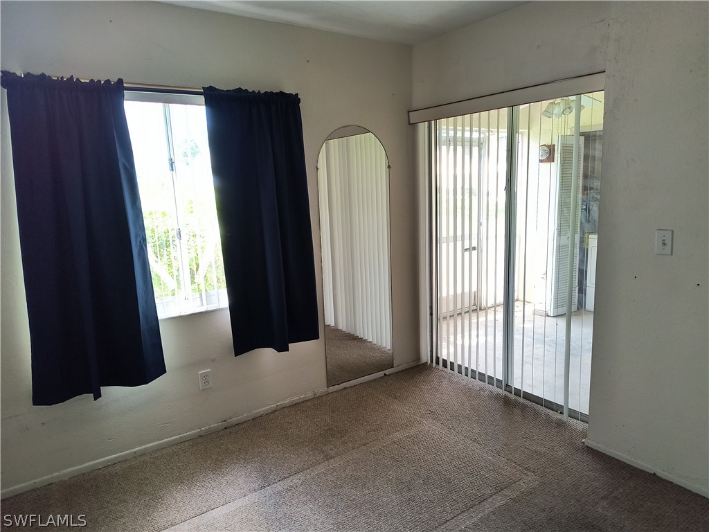 1100 Pondella Road, Unit 1001 Cape Coral, FL 33909 - Photo 7 of 14 a view of a front door and porch