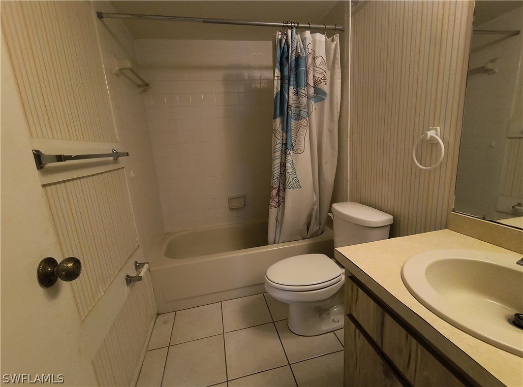 1100 Pondella Road, Unit 1001 Cape Coral, FL 33909 - Photo 9 of 14 a bathroom with a sink toilet and shower
