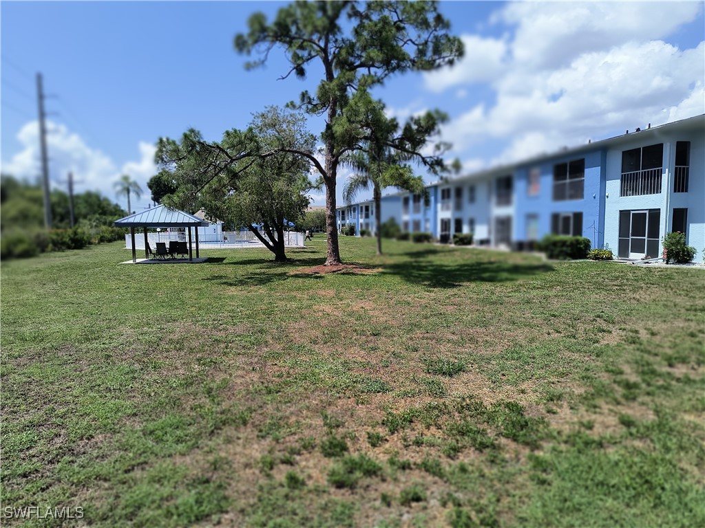 1100 Pondella Road, Unit 1001 Cape Coral, FL 33909 - Photo 10 of 14 a house view with a garden space