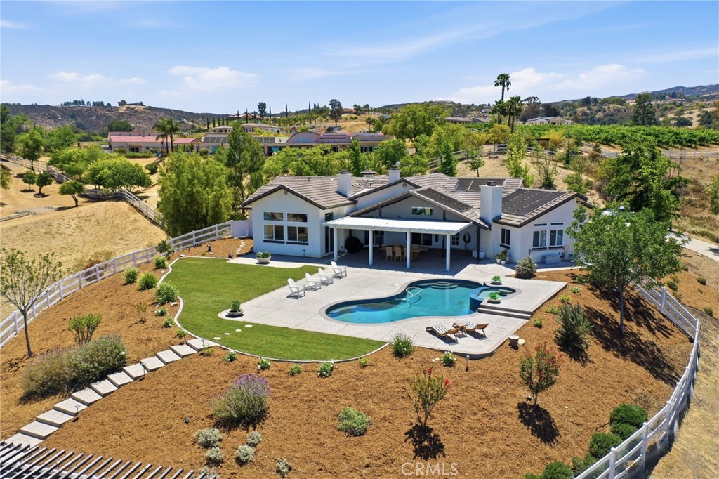 41110 Los Ranchos Circle Temecula, CA 92592 - Photo 63 of 77 an aerial view of a house with a big yard