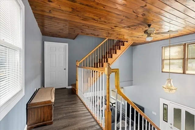 a view of an entryway with wooden floor