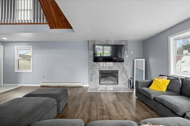 a living room with furniture and a fireplace