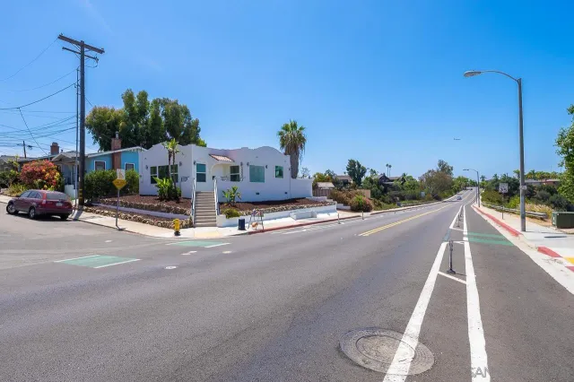 a view of a street with cars