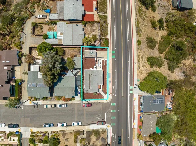 an aerial view of city and lake