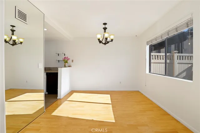 a view of staircase with railing and wooden floor