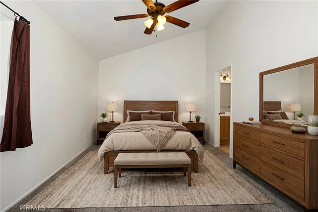 a bathroom with a sink a toilet a mirror and shower