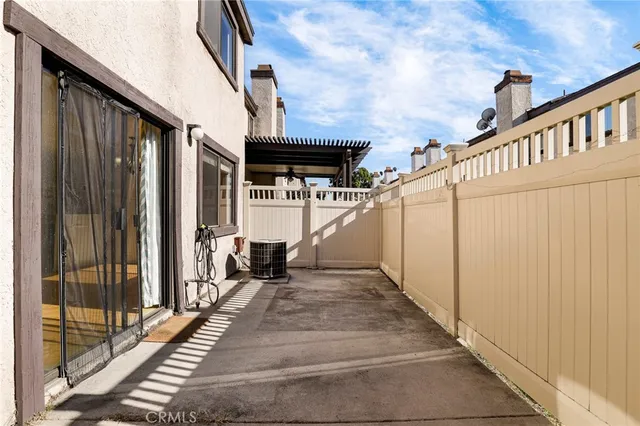 an aerial view of a house with garden space and street view