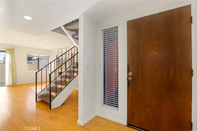 a view of staircase with wooden floor and stairs
