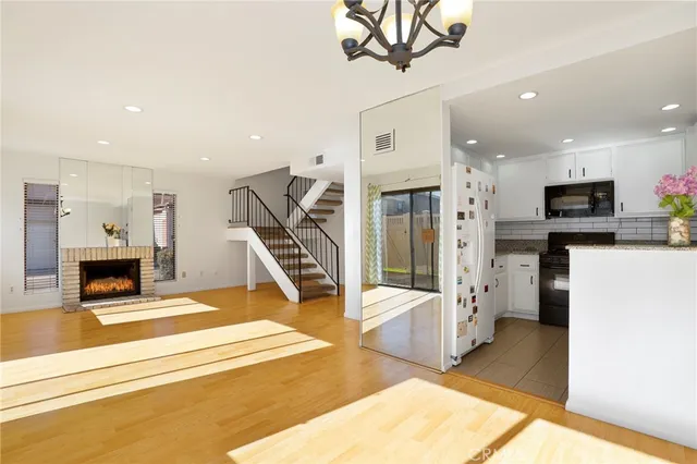a view of a kitchen with furniture and a ceiling fan