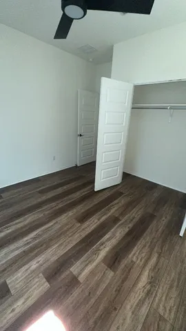 a view of room with wooden floor