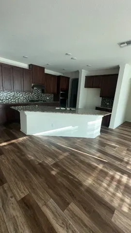 a view of living room kitchen and kitchen