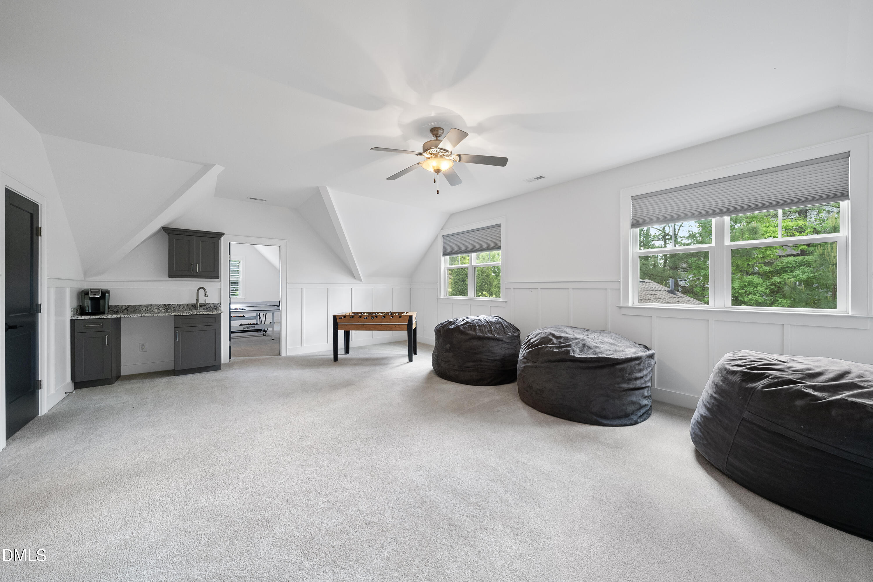 5109 Wainscott Way Raleigh, NC 27612 - Photo 32 of 52 a living room with furniture and a chandelier