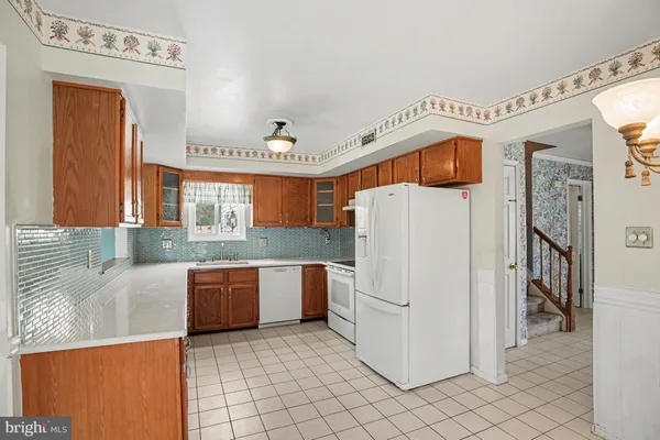 a view of kitchen cabinets and window