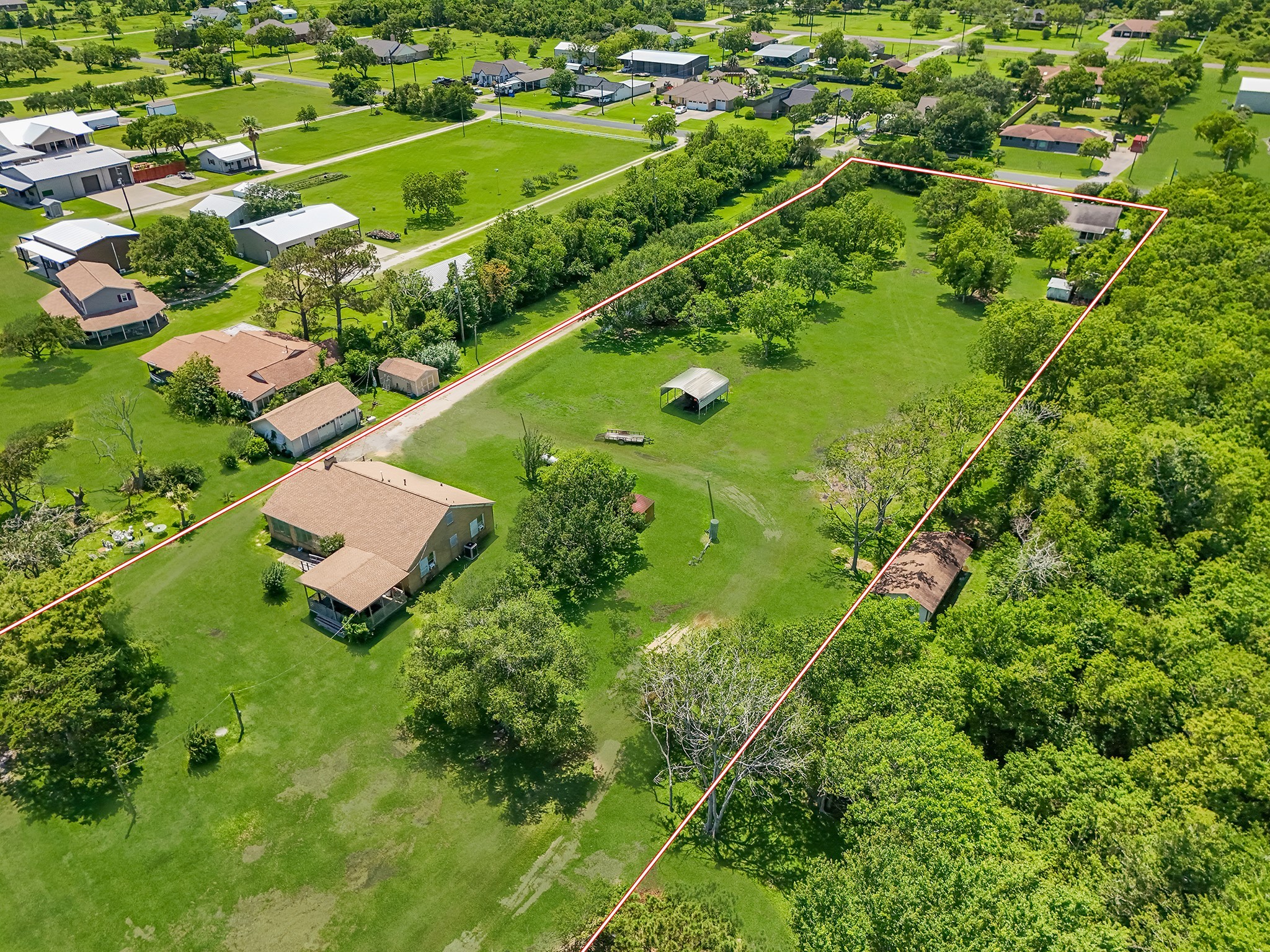 11910 Cedar Gully Road Beach City, TX 77523 - Photo 12 of 50 a view of a garden with a lake