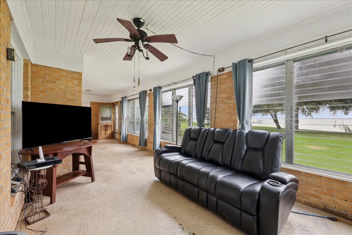 11910 Cedar Gully Road Beach City, TX 77523 - Photo 21 of 50 a living room with furniture and a flat screen tv