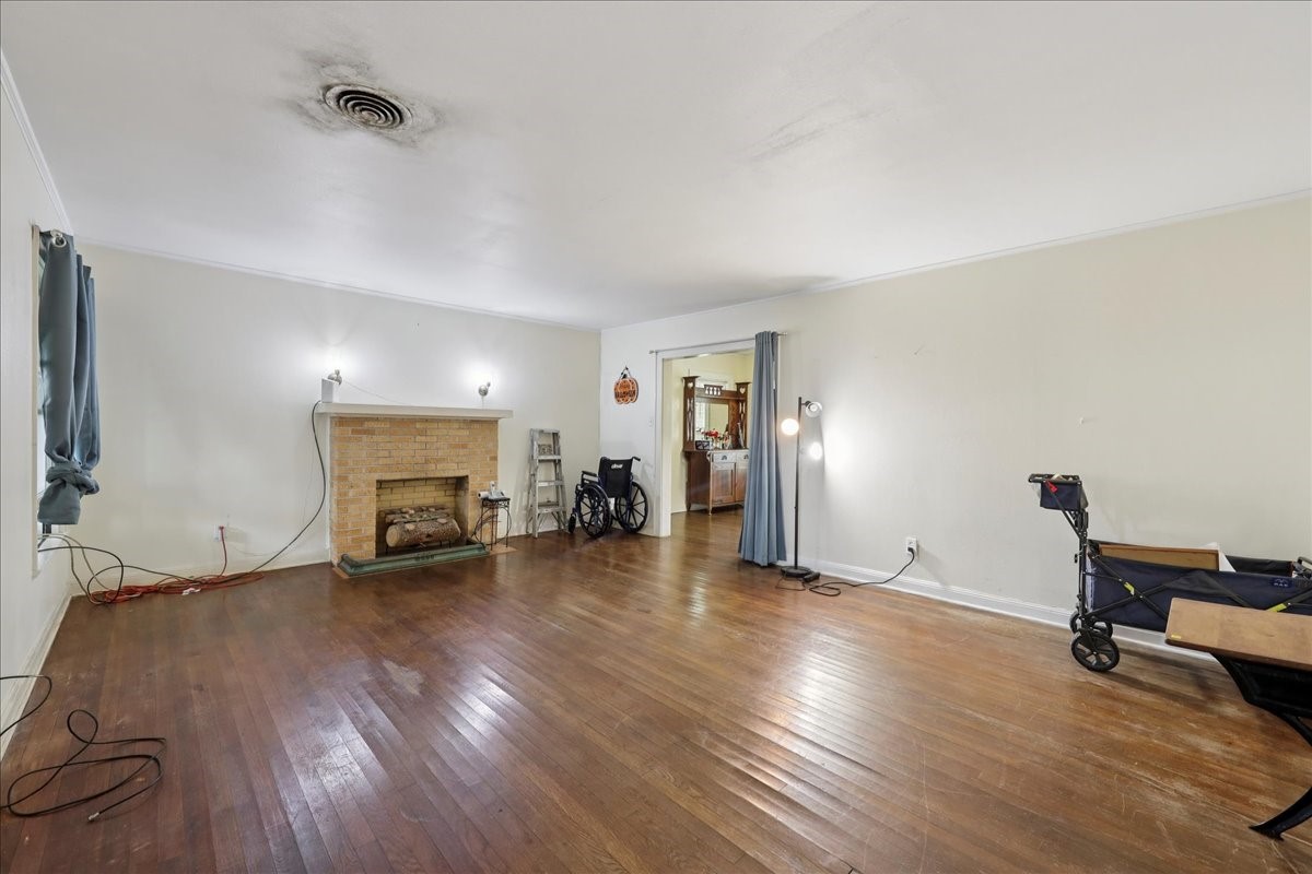 11910 Cedar Gully Road Beach City, TX 77523 - Photo 23 of 50 a view of a livingroom with a fireplace and a workspace